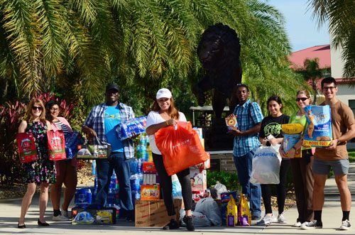 Crystal Springs, center and volunteers get ready to load donations for the Bahamas from Saint Leo University
